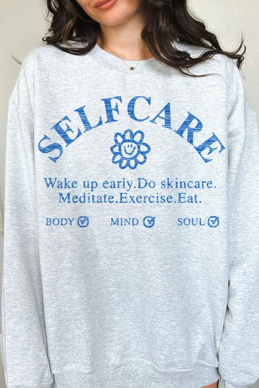 SELF CARE GRAPHIC SWEATSHIRT